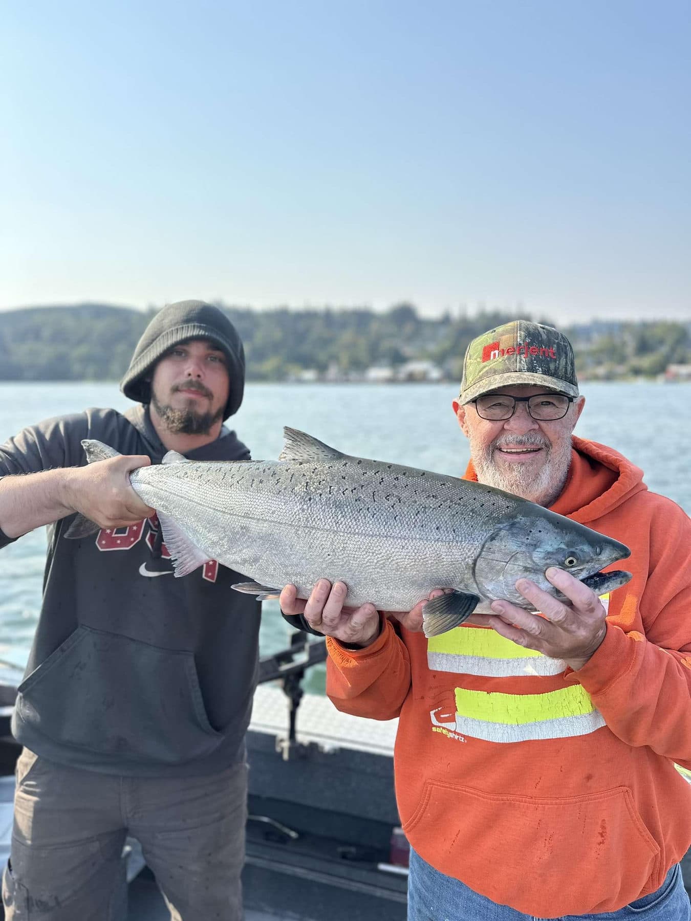Jacob with a client and their catch