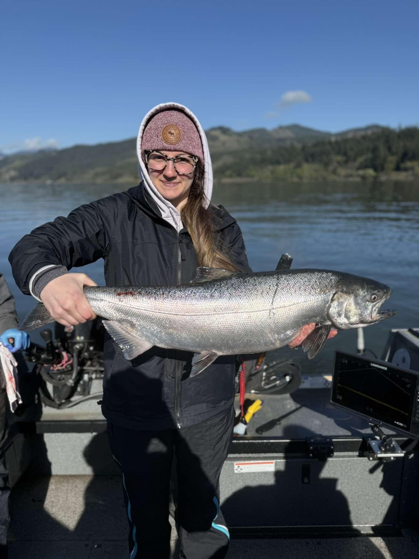 Father and son holding their limit of salmon